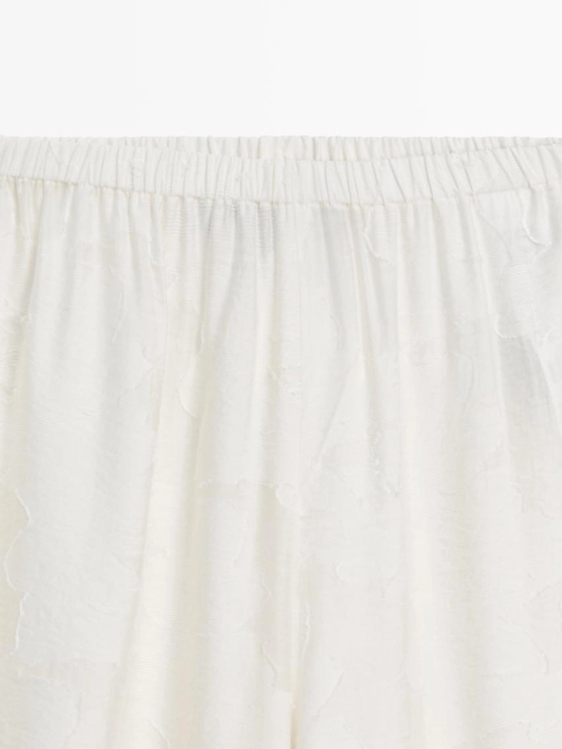 Широкие брюки из текстильной ткани со вставкой