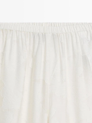 Широкие брюки из текстильной ткани со вставкой- Заказать в России