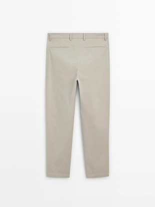 Брюки из хлопка в узком крое- Заказать в России