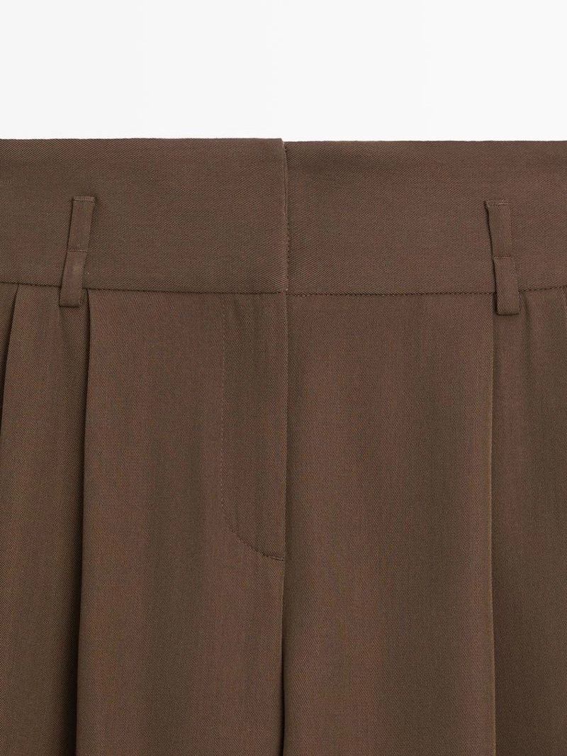 Длинные бермуды с подвернутыми краями