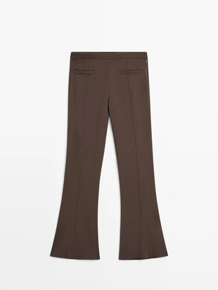 Брюки-клеш с карманом- Заказать в России