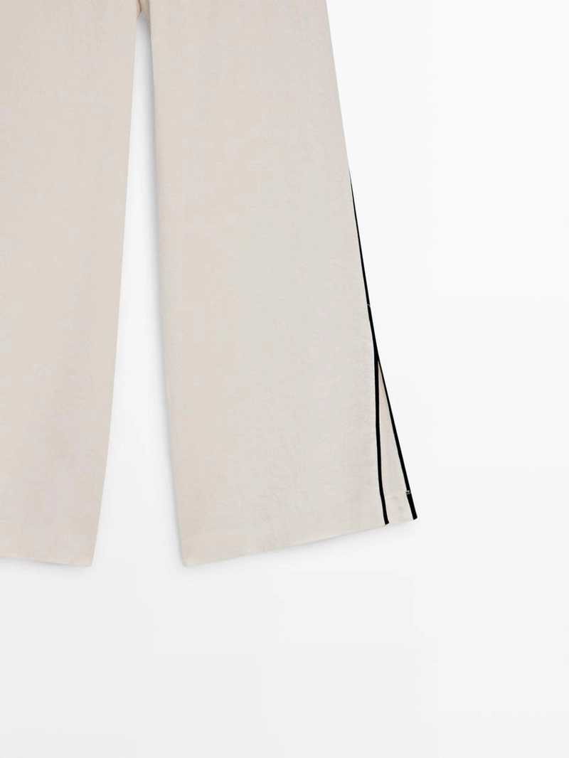 Брюки из льна с контрастной отделкой