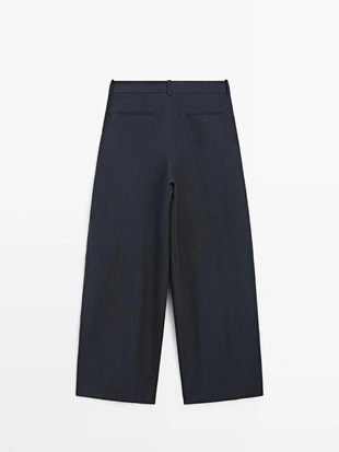 Брюки с плиссированными деталями из плавной ткани- Заказать в России