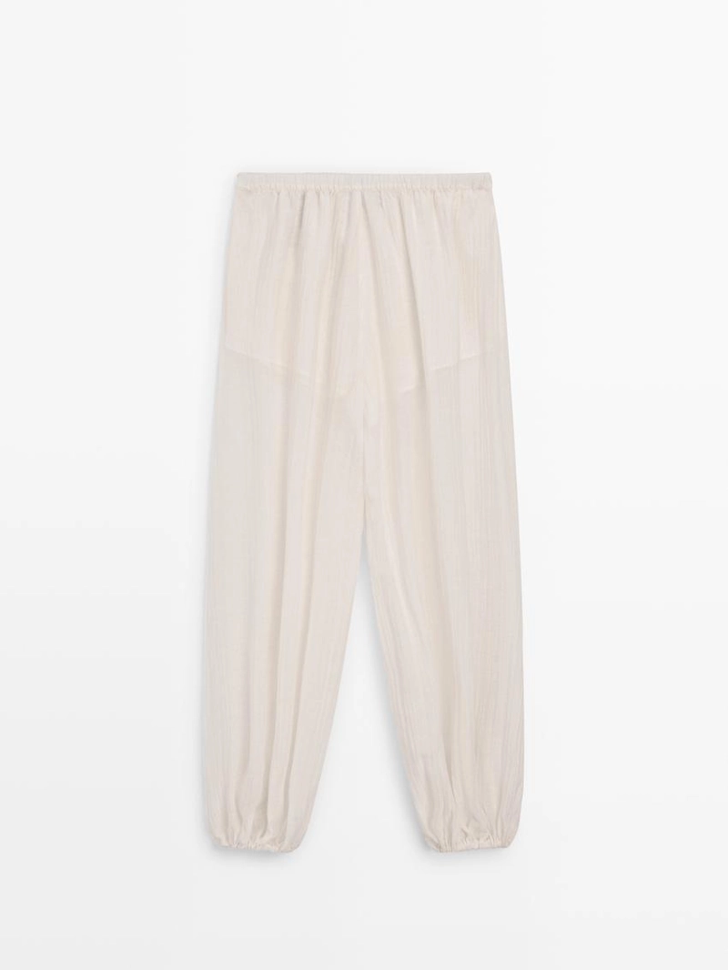 Брюки-саруэль flowing с деталями в складку