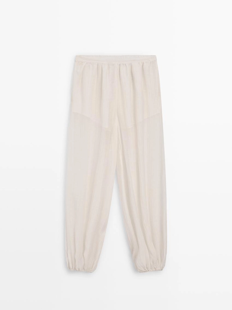 Брюки-саруэль flowing с деталями в складку