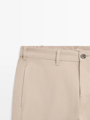 Брюки из хлопкового смесового материала в зауженном крое- Заказать в России