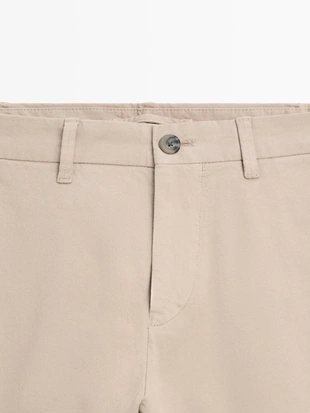 Брюки из хлопкового смесового материала в зауженном крое- Заказать в России