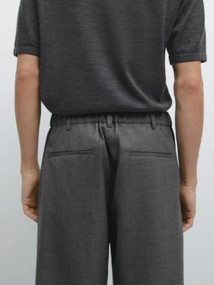 Брюки из шерсти свободного кроя с деталями вытачек- Заказать в России