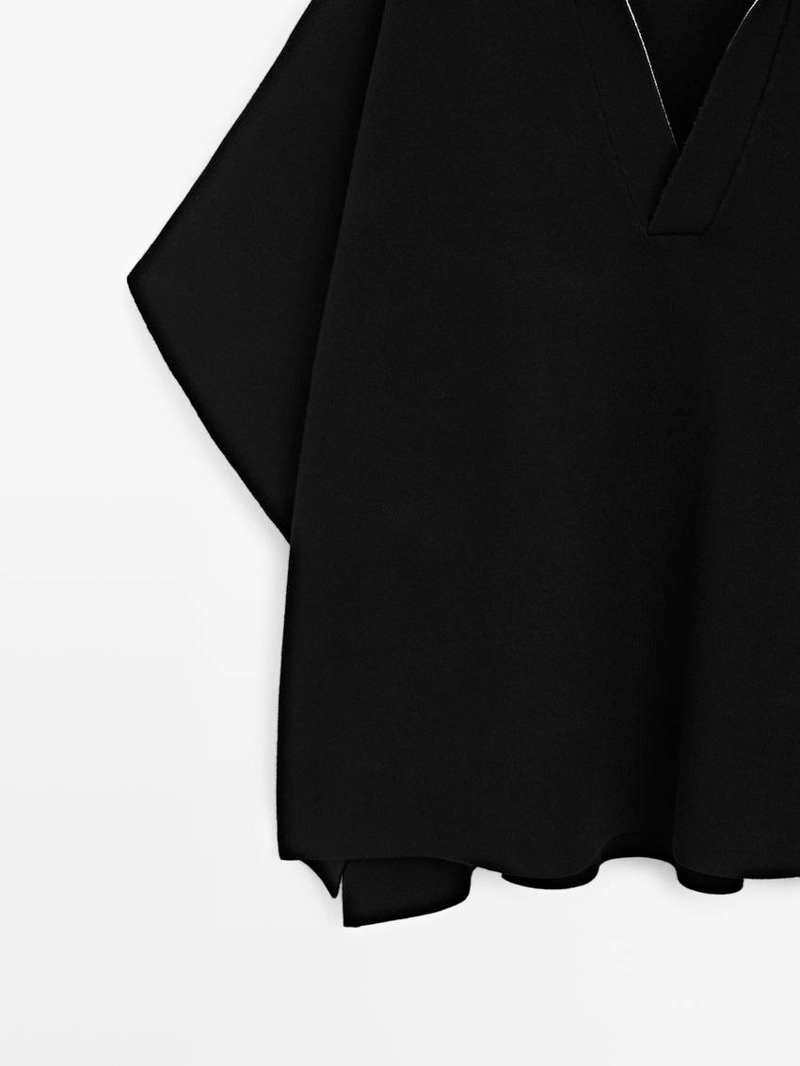 Короткая вязаная накидка с v-образным вырезом