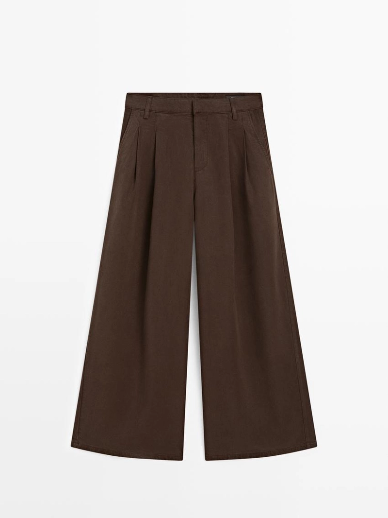 Широкие зауженные брюки с защипами