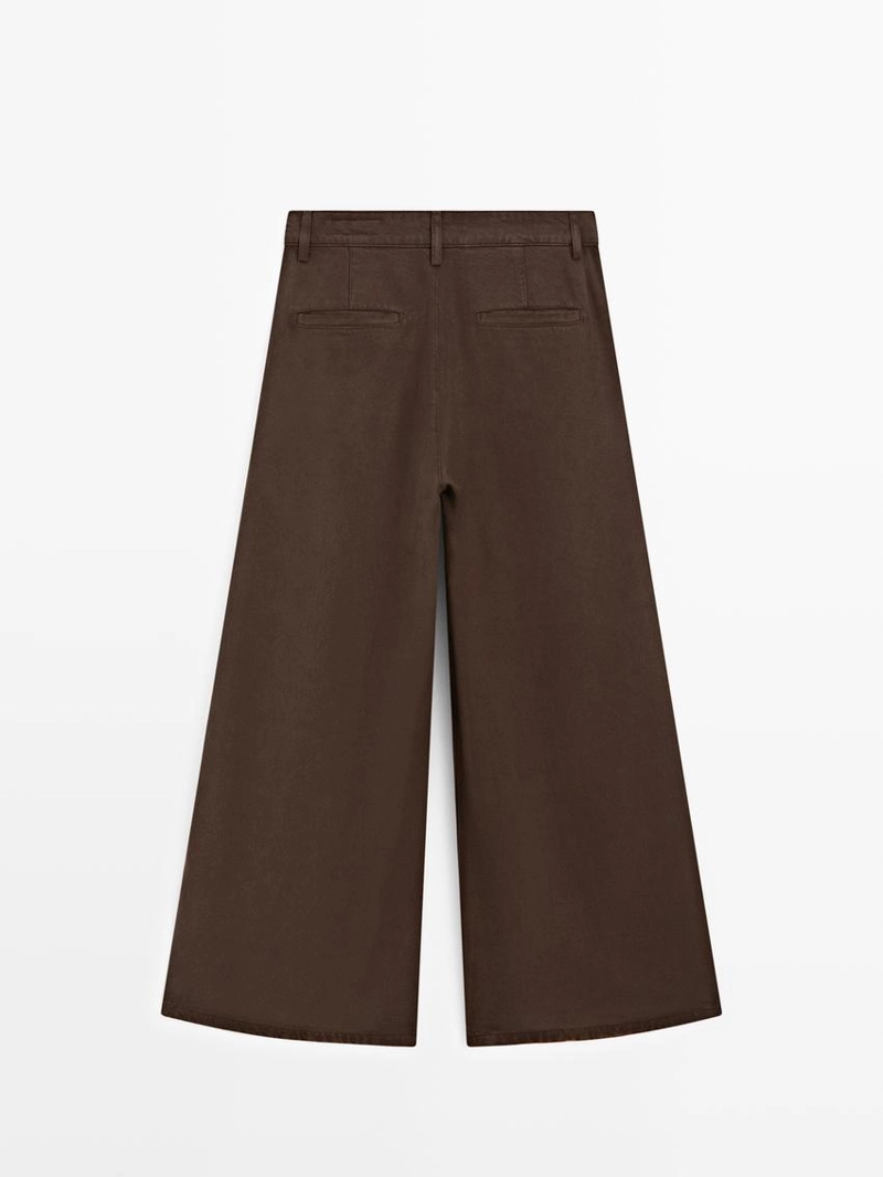 Широкие зауженные брюки с защипами