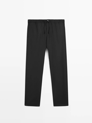 Брюки из шерсти свободного кроя- Заказать в России