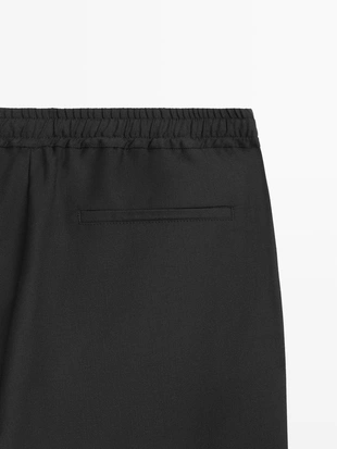 Брюки из шерсти свободного кроя- Заказать в России