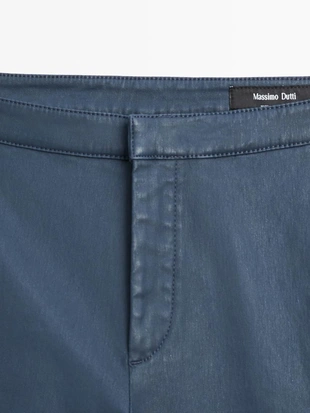 Брюки-клеш облегающего кроя с укороченными штанинами- Заказать в России