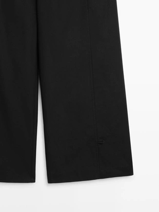 Брюки из хлопково-шелковой смеси с деталями на подоле- Заказать в России