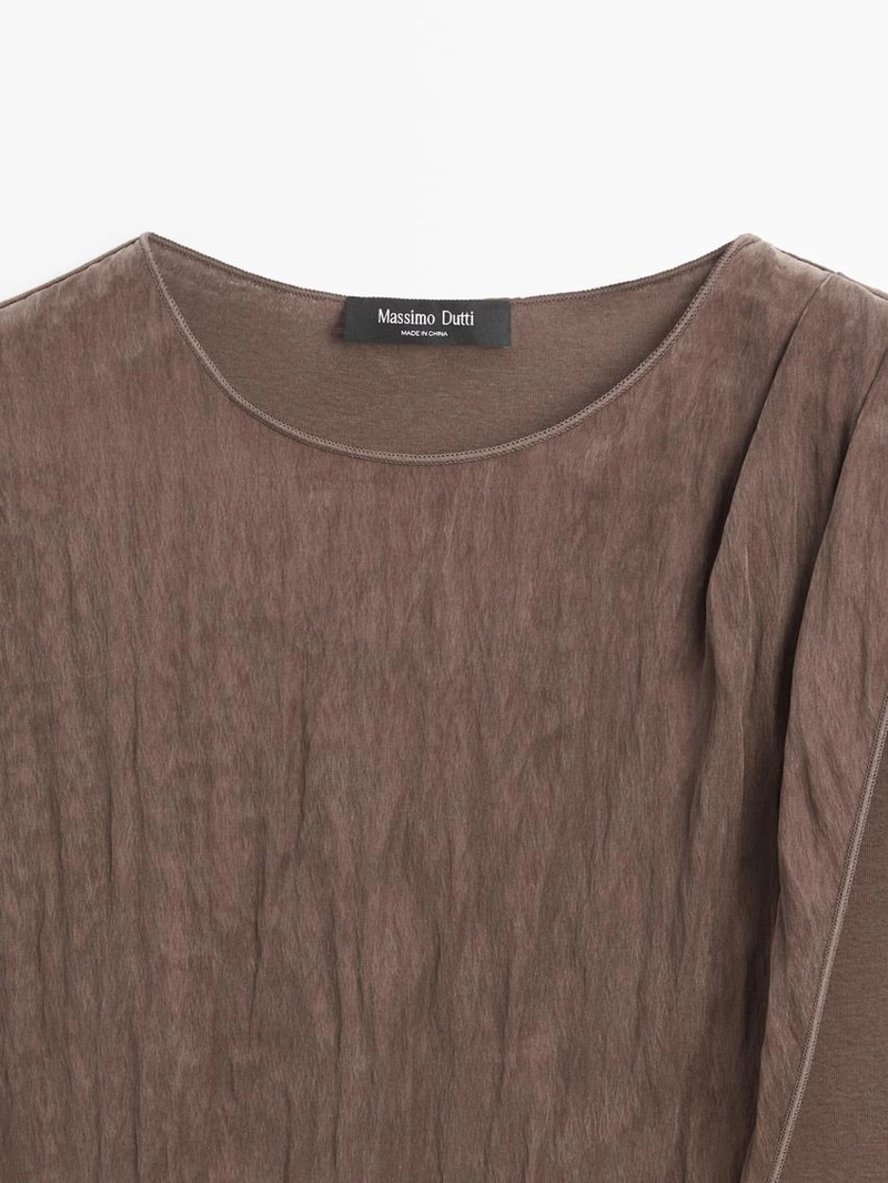 Топ с перекрещивающимися линиями и деталью шарфика на плече