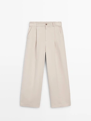 Широкие брюки с эластичным поясом- Заказать в России