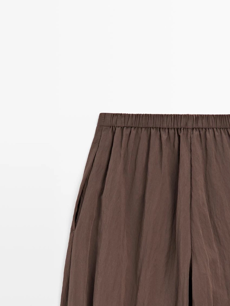 Потоковые зауженные брюки