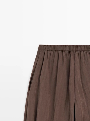 Потоковые зауженные брюки- Заказать в России