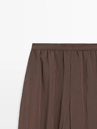 Потоковые зауженные брюки- Заказать в России