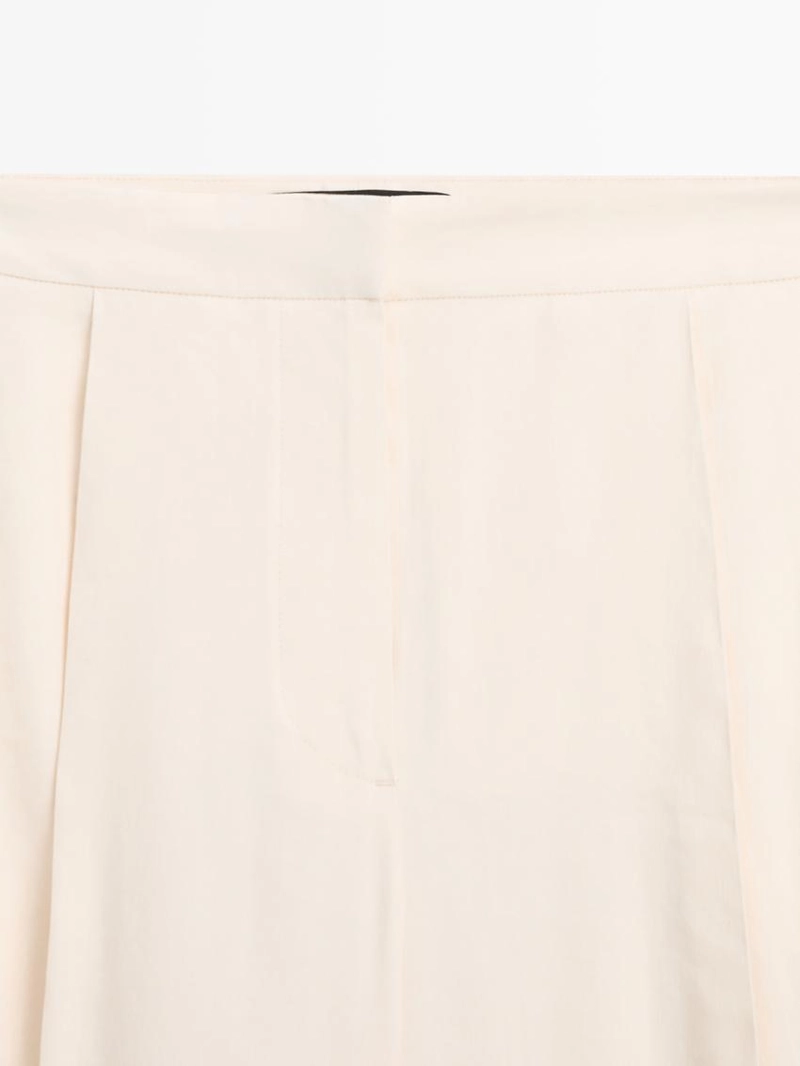 Брюки свободного кроя с завышенной талией