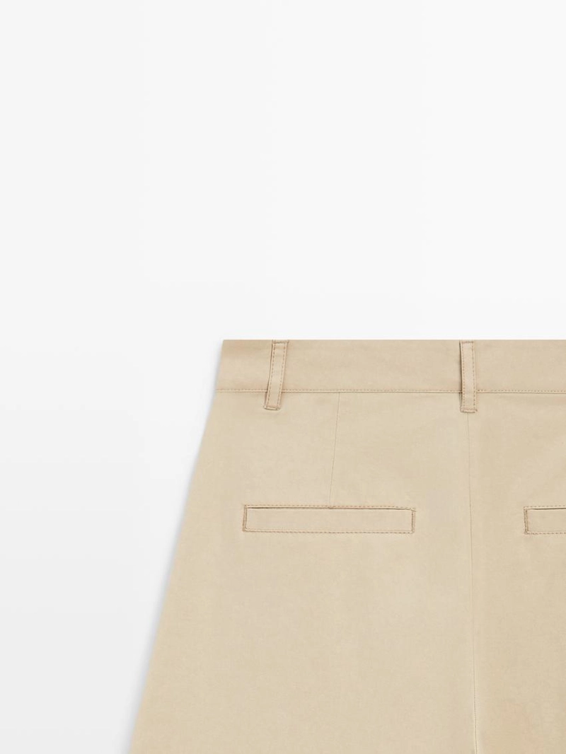 Широкие брюки с защипами