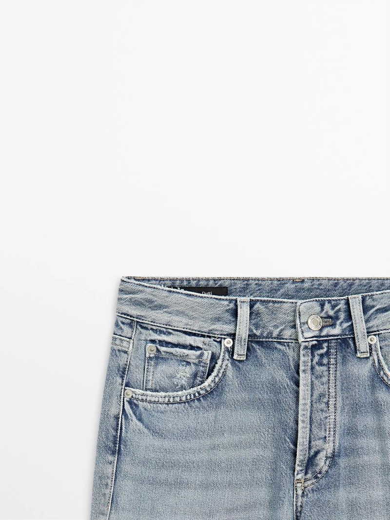 Джинсы с широкими штанинами на средней талии