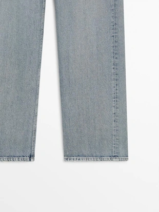 Джинсы с широкими штанинами на средней талии- Заказать в России