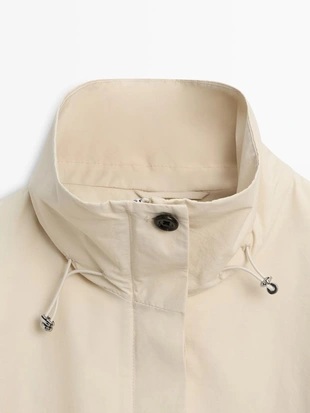 Куртка-бомбер с высоким воротником и объемной стежкой- Заказать в России