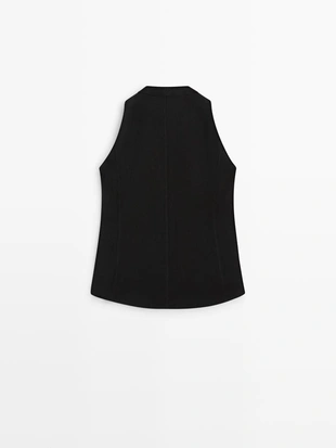 Жилет на две пуговицы с деталями на пуговицах- Заказать в России