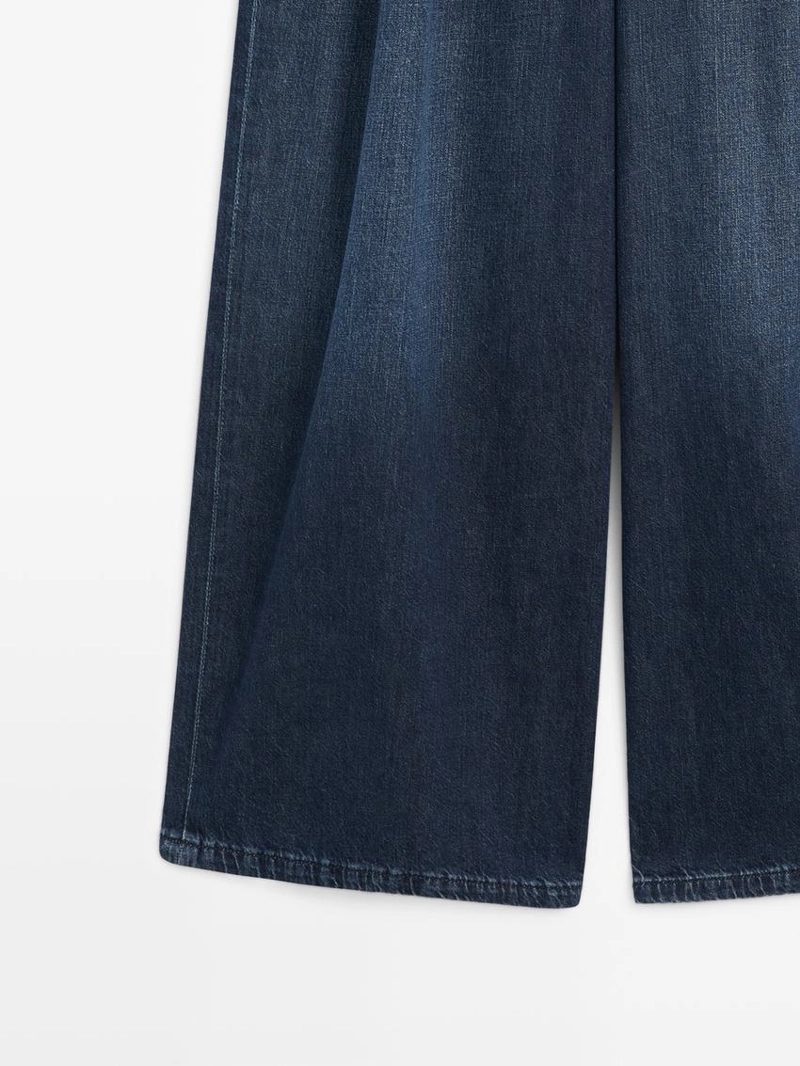 Джинсы с высокой посадкой и широкими штанинами