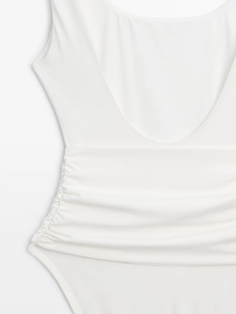 Купальник с деталями из драгоценных камней