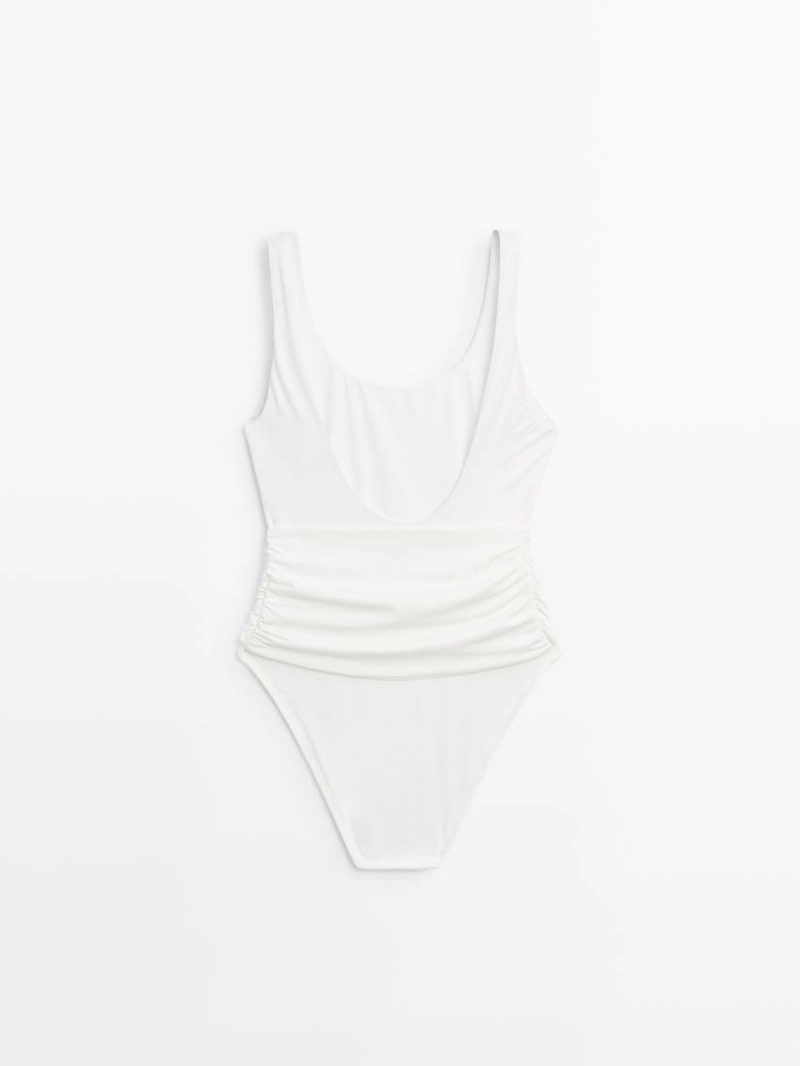 Купальник с деталями из драгоценных камней