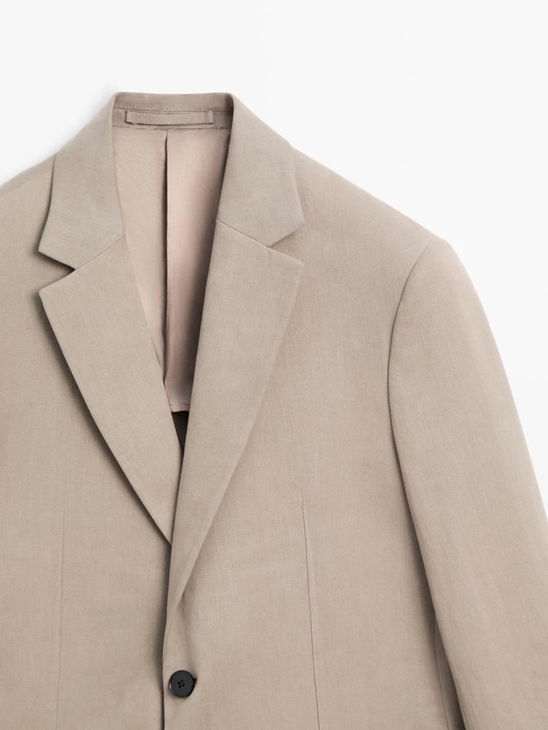 Пиджак из льна с приталенным кроем и деталями карманов