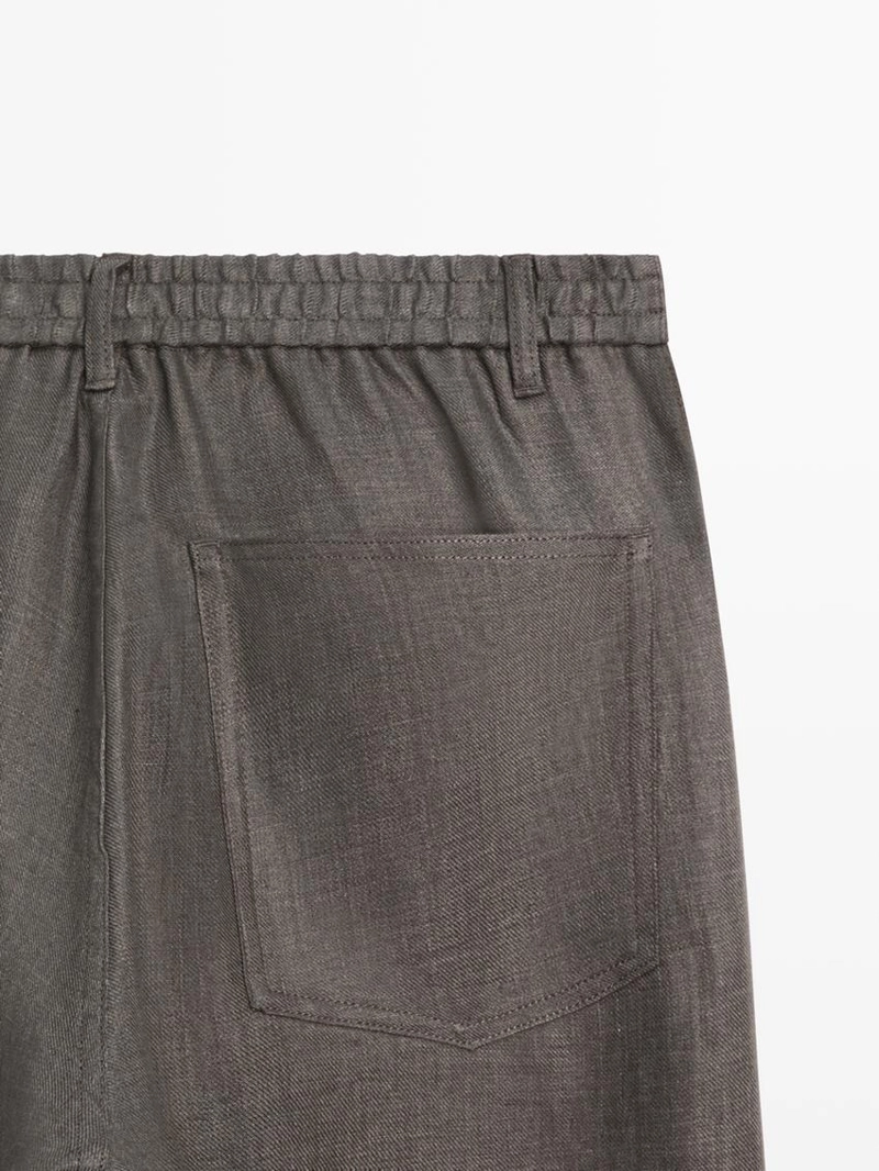 Льняные джинсовые брюки полуприталенного кроя