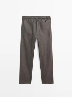 Льняные джинсовые брюки полуприталенного кроя- Заказать в России