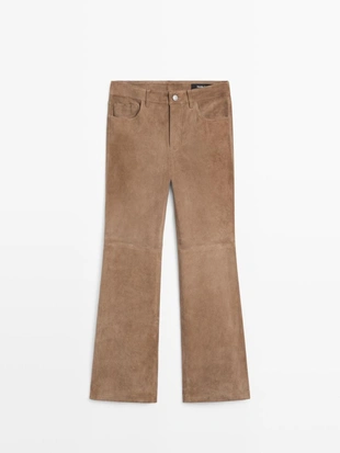 Кожаные леггинсы с запахом и расклешенными штанинами- Заказать в России