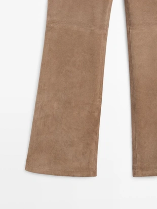 Кожаные леггинсы с запахом и расклешенными штанинами- Заказать в России