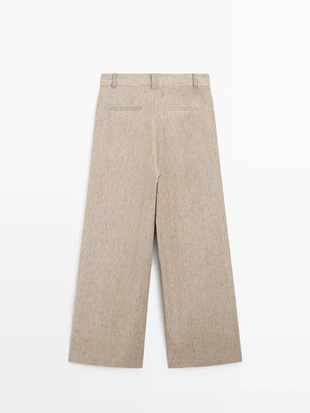 Льняные меланжевые брюки с защипами- Заказать в России