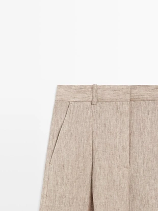 Льняные меланжевые брюки с защипами- Заказать в России