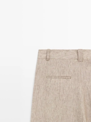 Льняные меланжевые брюки с защипами- Заказать в России