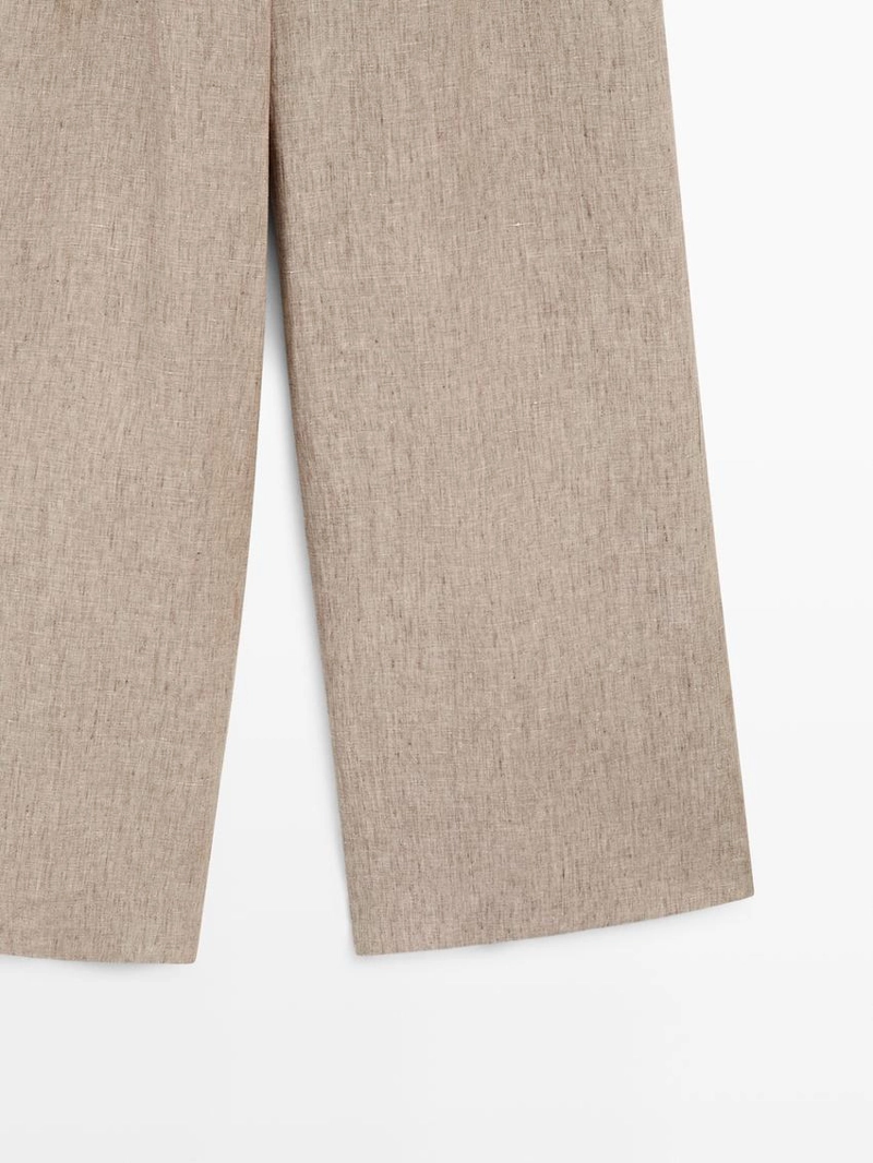 Льняные меланжевые брюки с защипами