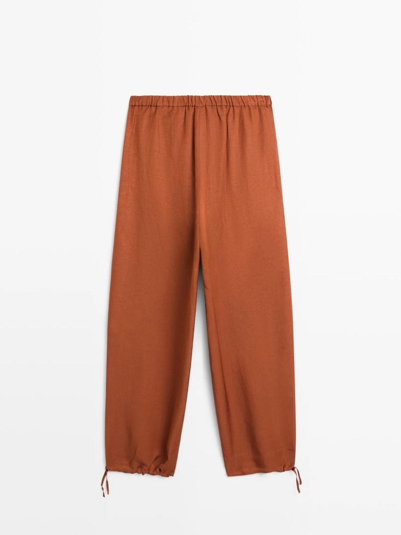 Брюки со свободным кроем и деталью на завязке