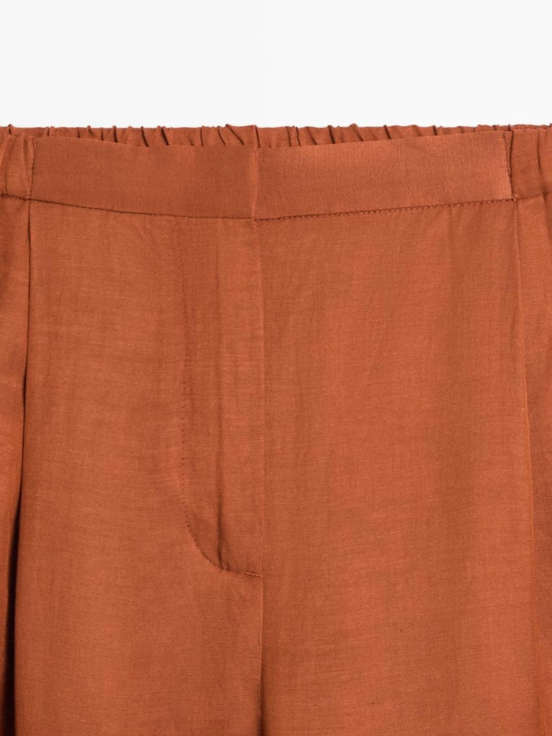 Брюки со свободным кроем и деталью на завязке