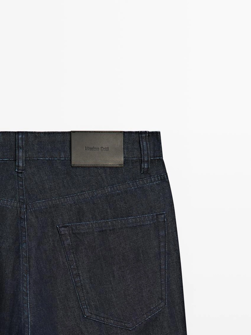 Джинсовые брюки со светлым эффектом и зауженным кроем