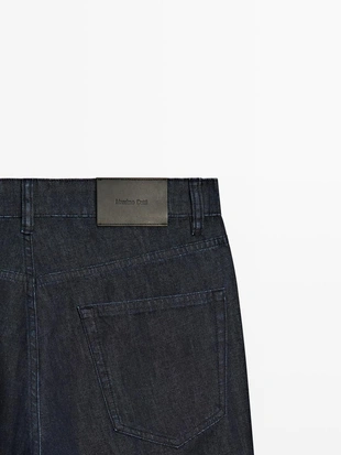 Джинсовые брюки со светлым эффектом и зауженным кроем- Заказать в России