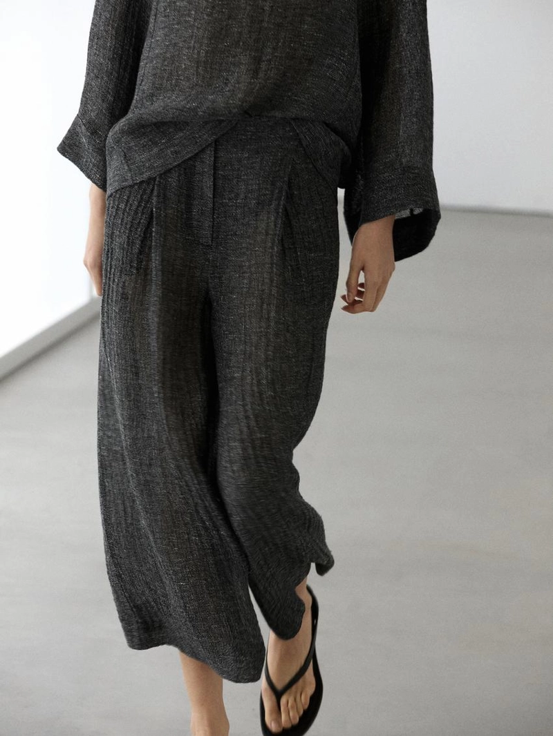 Брюки из меланжевого льна с защипами