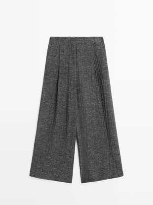 Брюки из меланжевого льна с защипами- Заказать в России