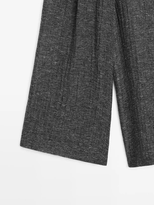 Брюки из меланжевого льна с защипами- Заказать в России