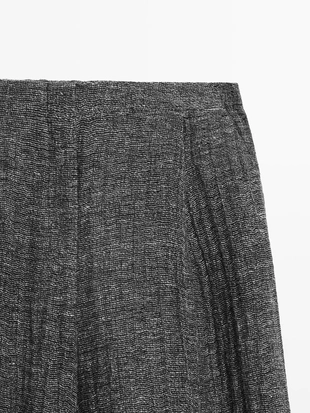 Брюки из меланжевого льна с защипами- Заказать в России